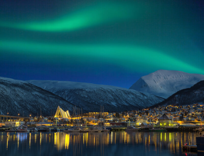 A winter night, as the northern lights dance across the Earth's sky. (Photo Credit: iStockphoto)