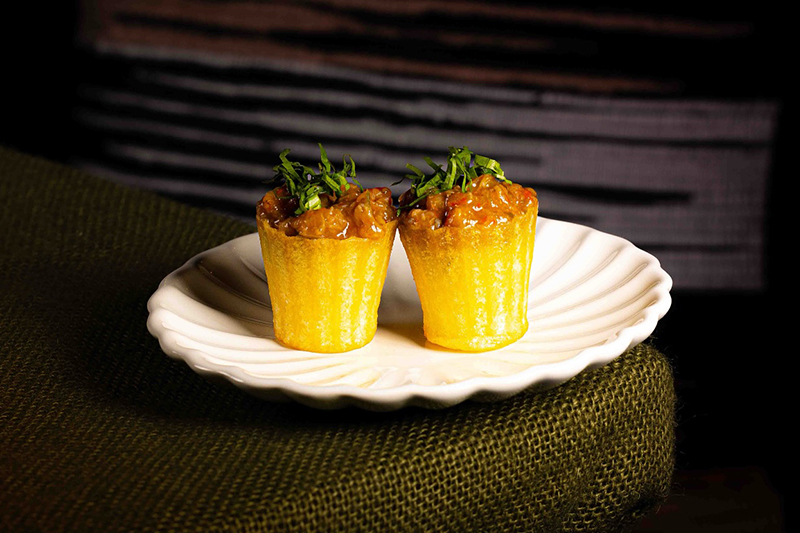 Thai eggplant relish with sticky rice and herbs.