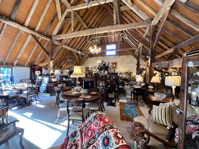The converted barn houses the antique items across the world.