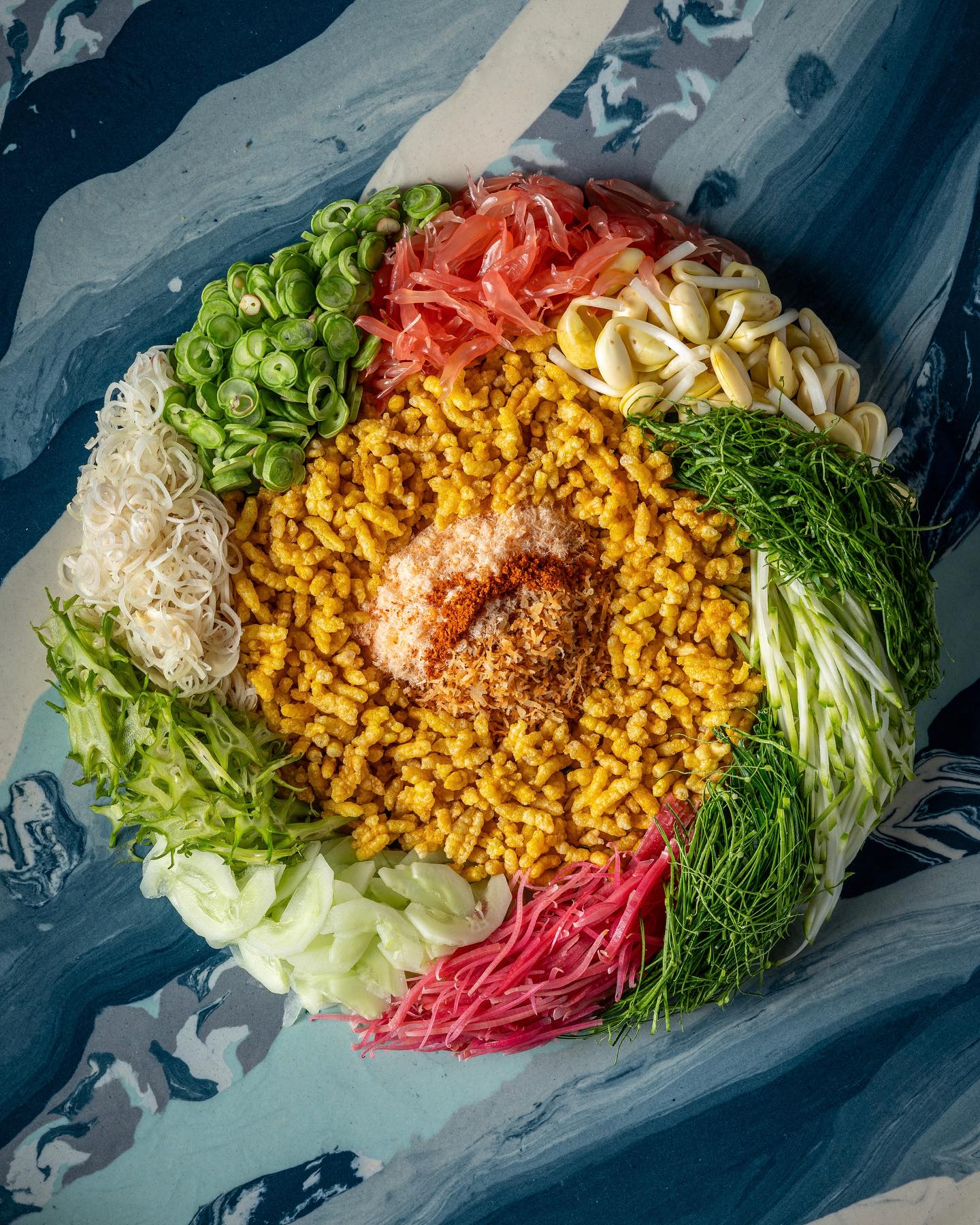Colorful and stunning. When the forest meets the sea - Southern vegetables and herbs, turmeric crispy rice, fermented fish innards dressing.