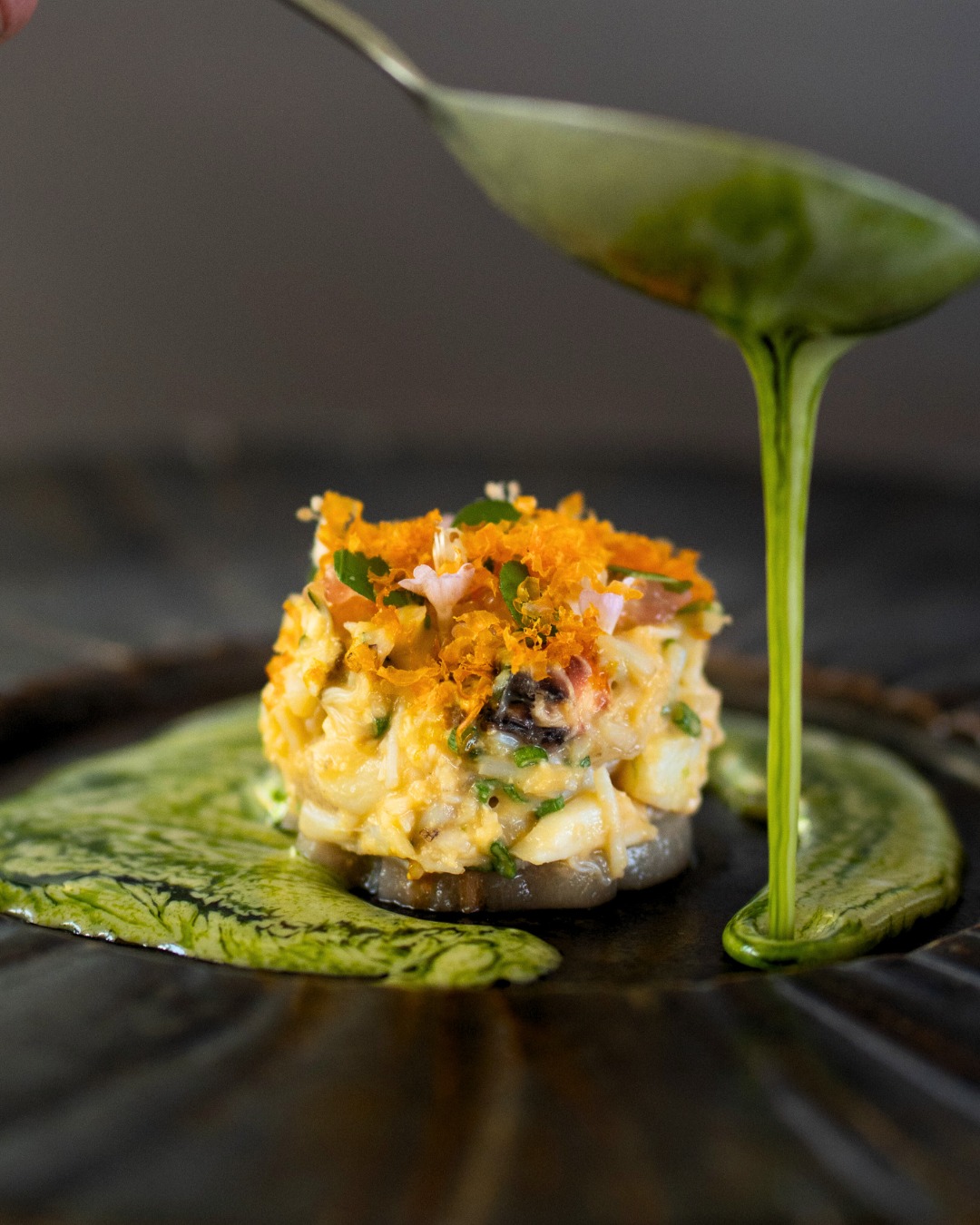 Black crab from Phang Nga, balanced with locally sourced fermented chickpeas, tea leaves, and Thai basil.