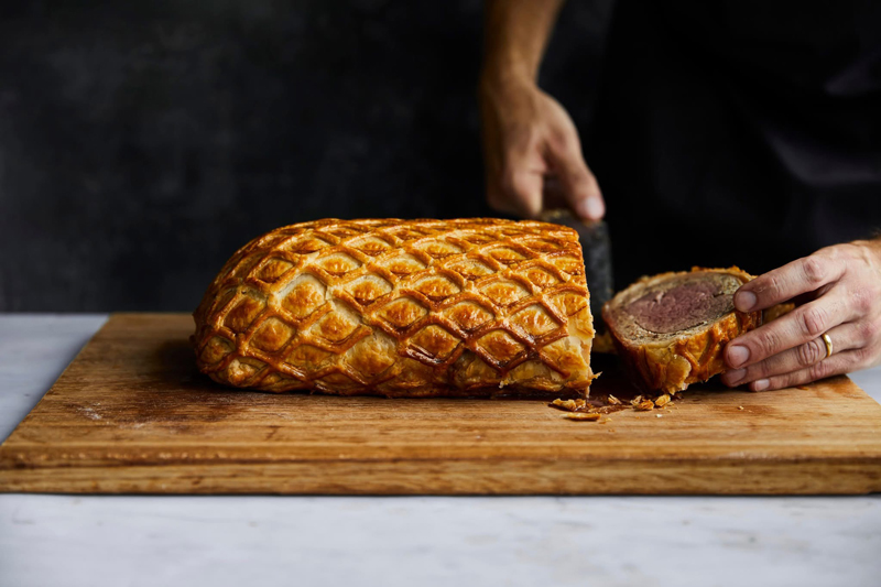 A well-made Beef Wellington is crisp due to its golden-brown, flaky puff pastry exterior.