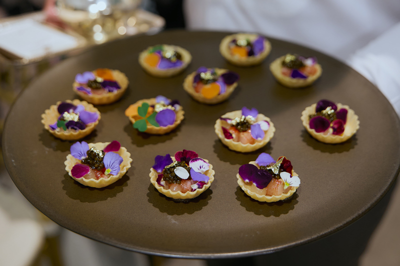 The edible flowers on top of the mini tartlets.