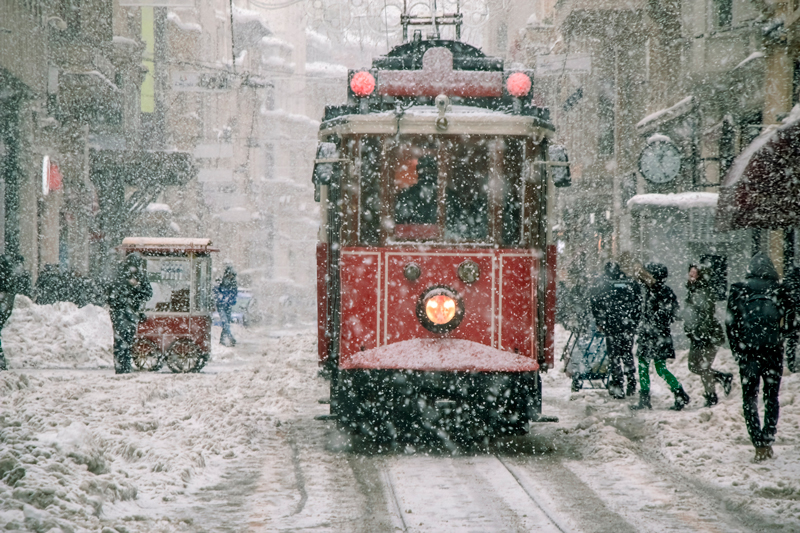 Istanbul's iconic red tram running through Istiklal Street.