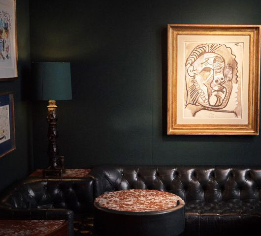 Converse undisturbed in the 1920s original dining room&mdash;where the only eavesdroppers are the masterpieces of Chagall, Rodin, and L&eacute;ger.