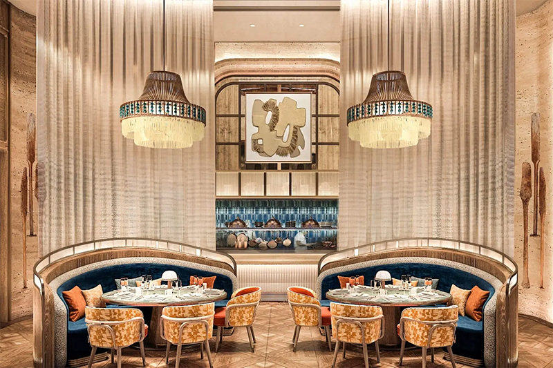 The space captures a playful elegance, blending bold colors and imaginative textures to create a truly whimsical atmosphere.