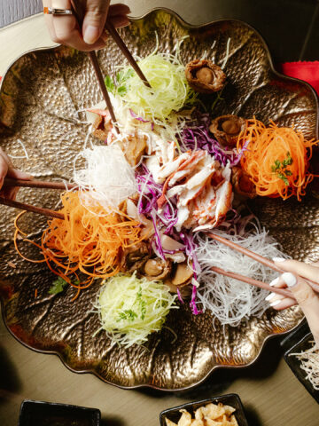 Yu Shen is a symbolic, colorful salad eaten during Chinese New Year.