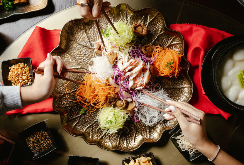 Yu Shen is a symbolic, colorful salad eaten during Chinese New Year.
