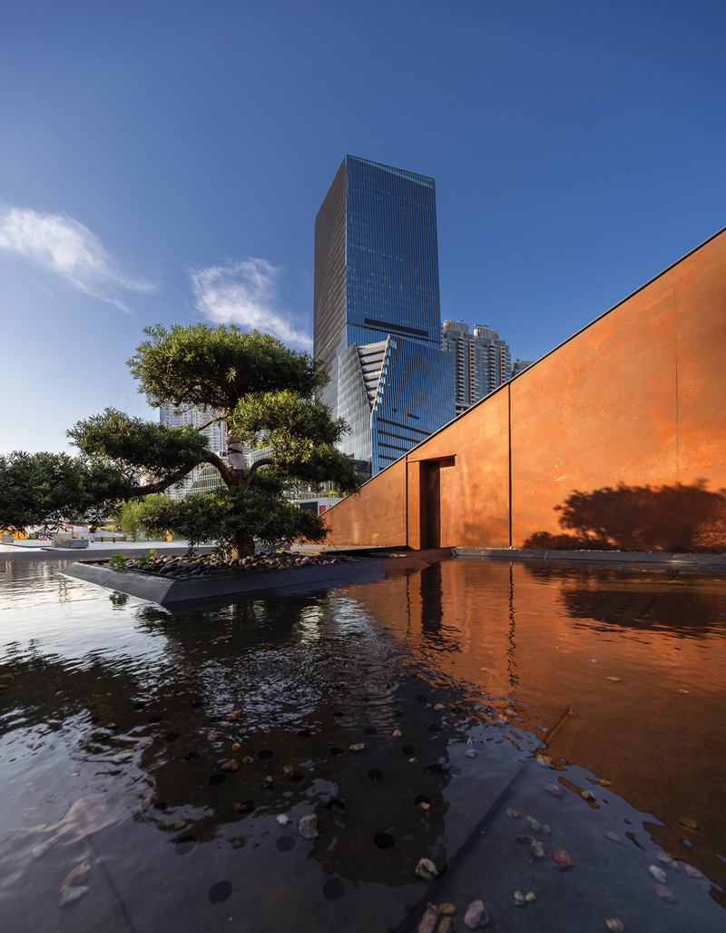 Contemporary architecture harmonizes with natural landscape at Kai Tak Station Square, reflecting the district&rsquo;s commitment to green urban planning.