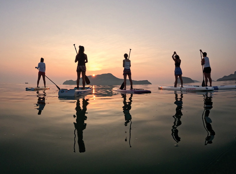 Drifting at sunset across calm seas