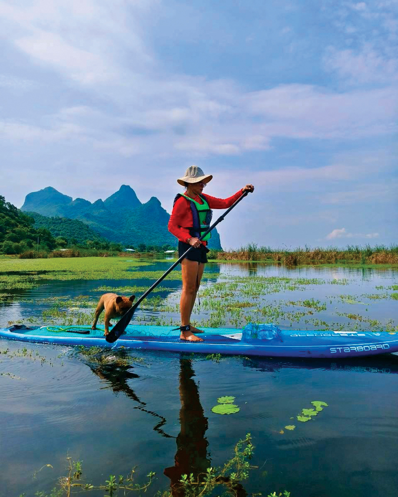 Stand-up paddleboarding at Sam Roi Yot Lotus wetland