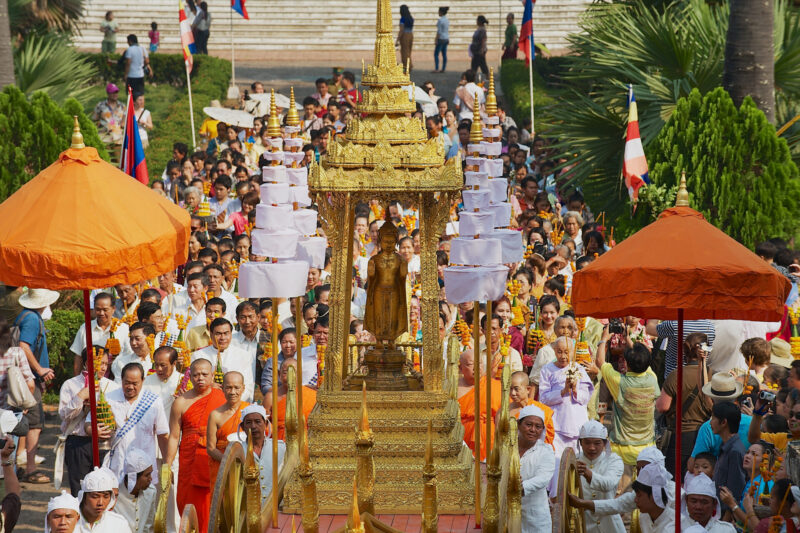 Pra Bang being taken out of the Royal palace to the Wat Mai during Phi Mai (Lao New Year) celebrations in Luang Prabang, Laos.