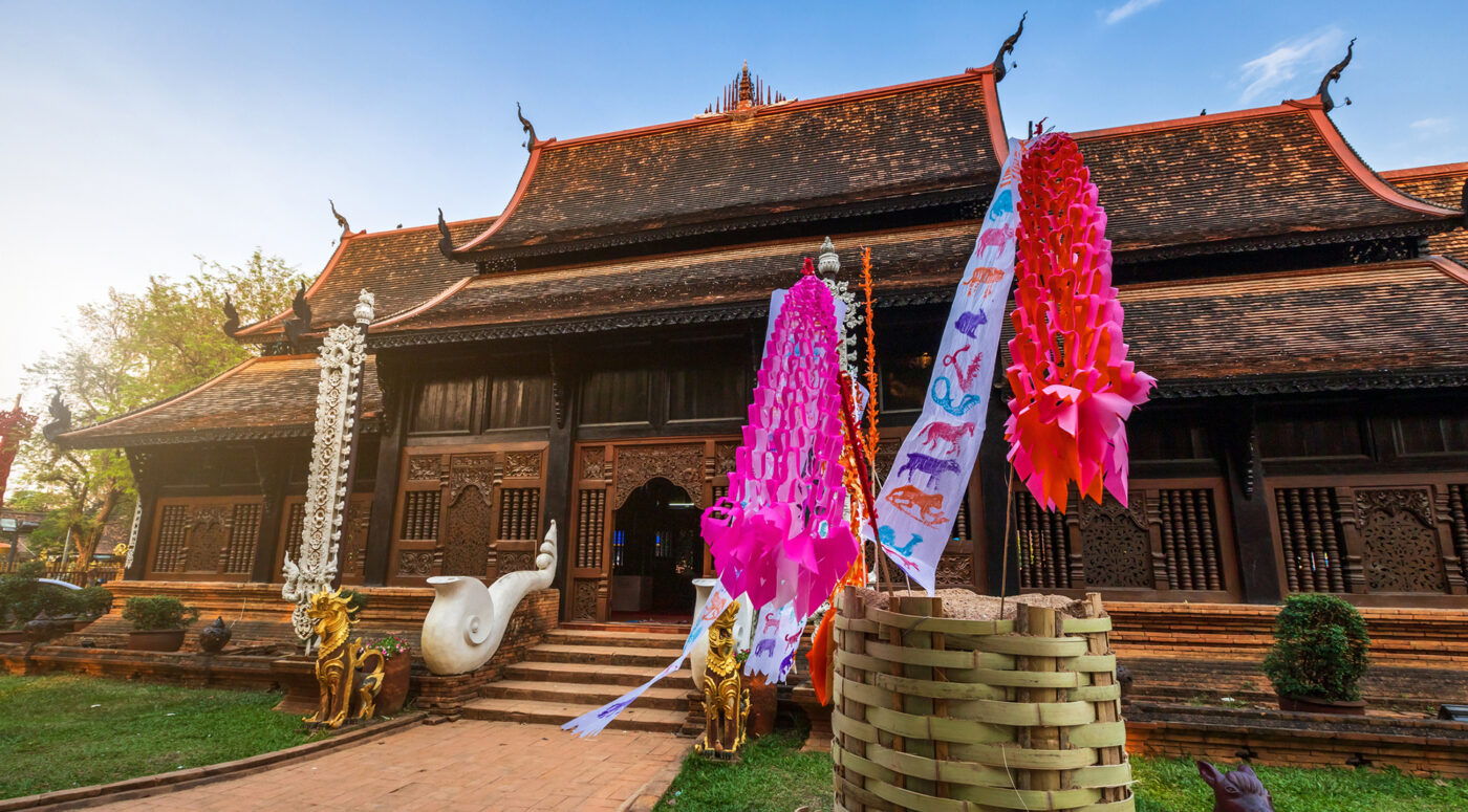 Traditional flags hang on sand pagoda in the Wat Lok Moli temple for Songkran Festival.