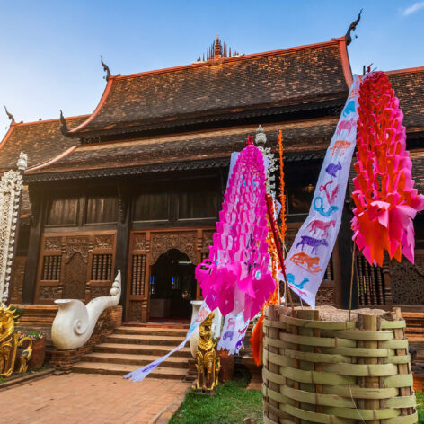 Traditional flags hang on sand pagoda in the Wat Lok Moli temple for Songkran Festival.
