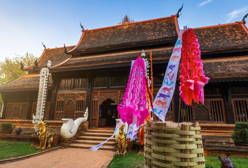 Traditional flags hang on sand pagoda in the Wat Lok Moli temple for Songkran Festival.