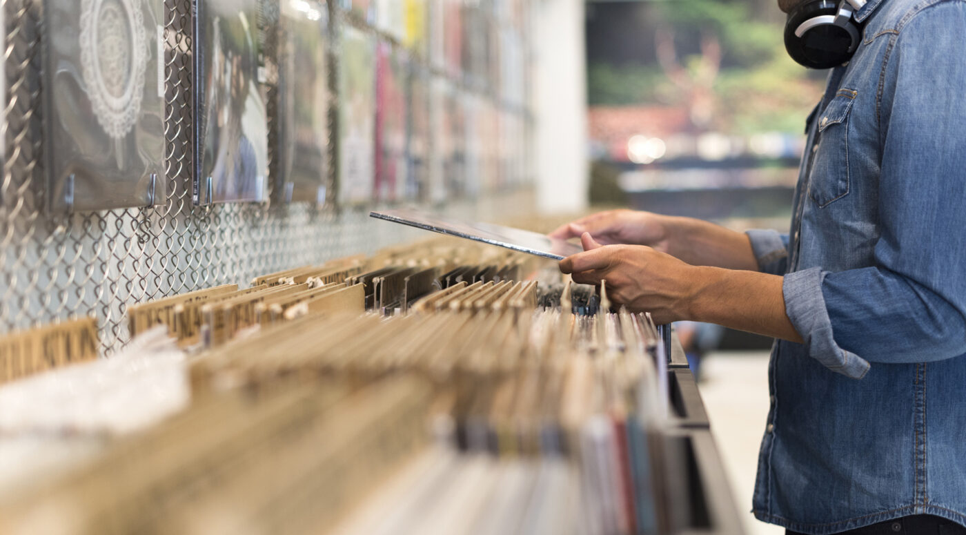 A moment of browsing vinyl album in a record store.