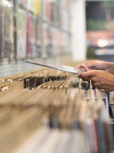 A moment of browsing vinyl album in a record store.