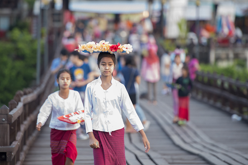 Locals and tourists often walk across the Wang Kka Wooden Bridge in Sangkhlaburi.