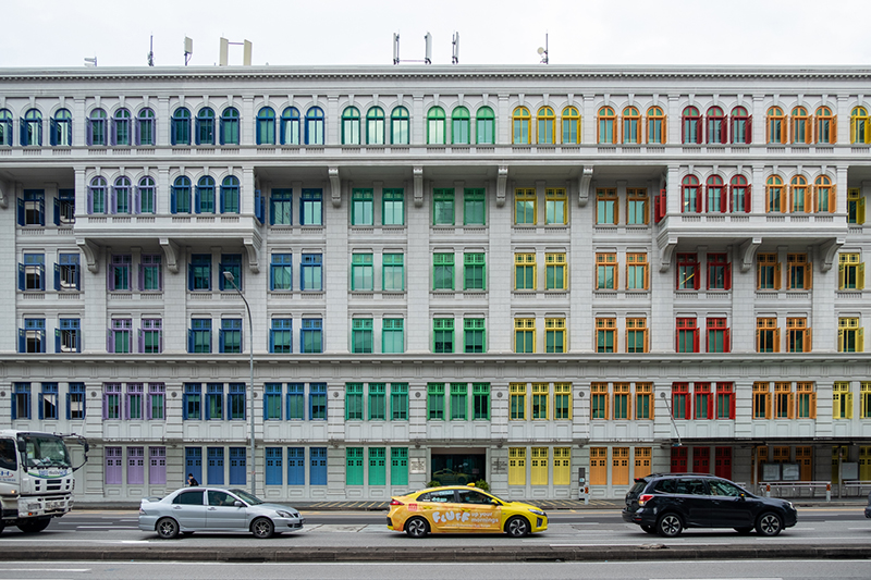 The road in front of the Old Hill Street Police Station with colorful rainbow window near Clarke Quay.