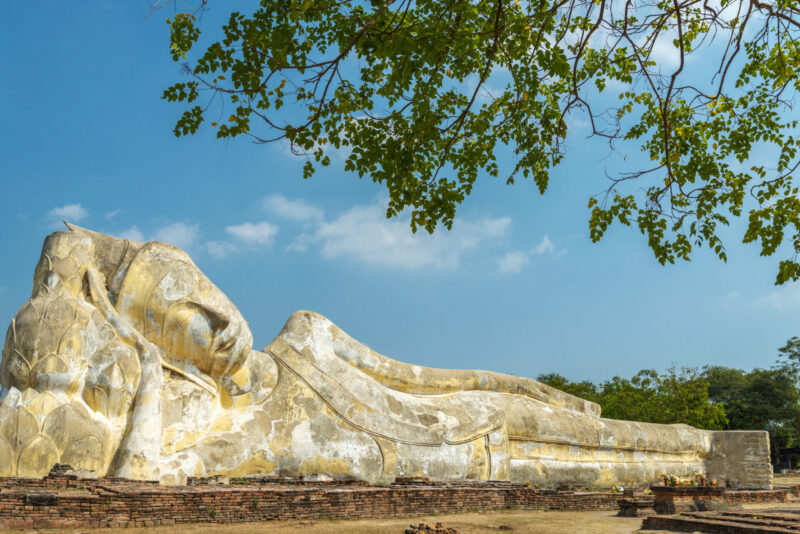 The huge stone statue of Buddha in the sun.