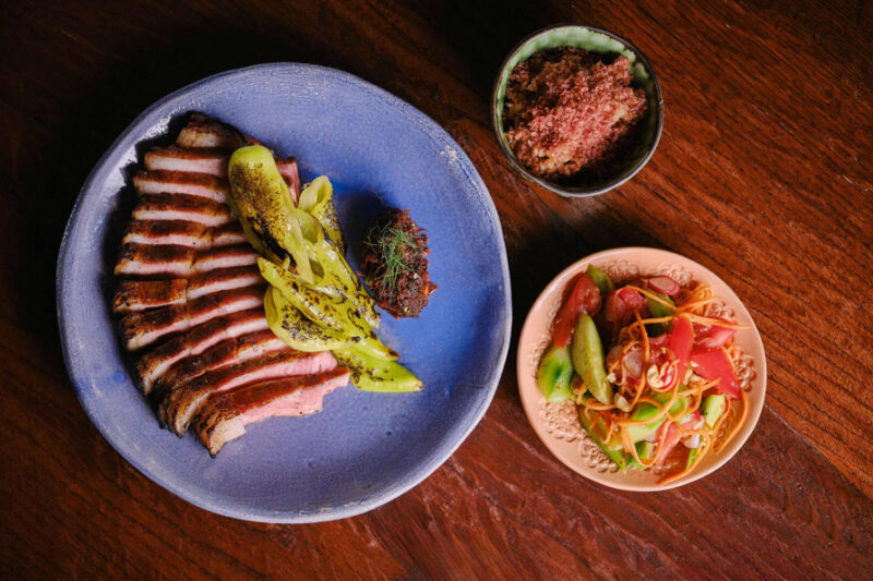 The iconic Blythburgh pork chop at AngloThai, glazed in pork fat and served with a robust smoked chili relish.