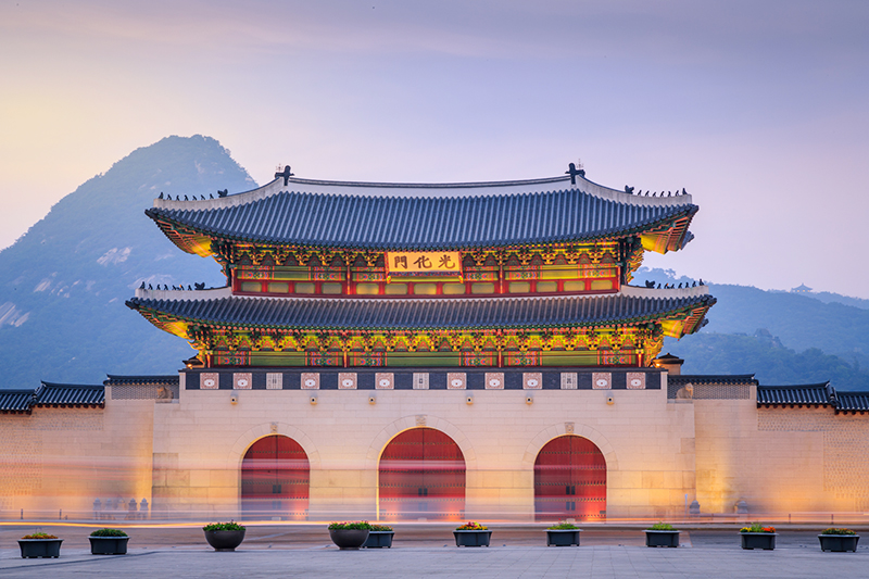 Gyeongbokgung Palace glowing just after sunset.
