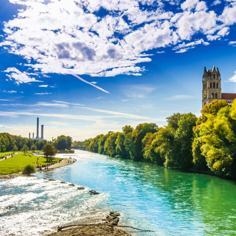 Summer landscape by St. Maximilian church and Isar in Munich.